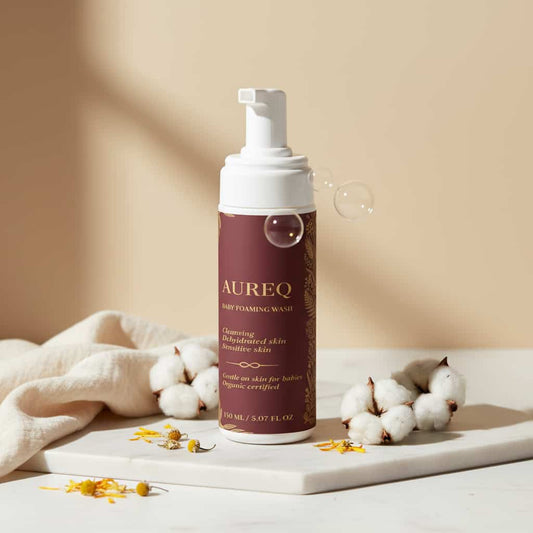 baby body foaming wash by AUREQ pump bottle with cotton and flowers, gentle COSMOS Natural certified newborn cleansing