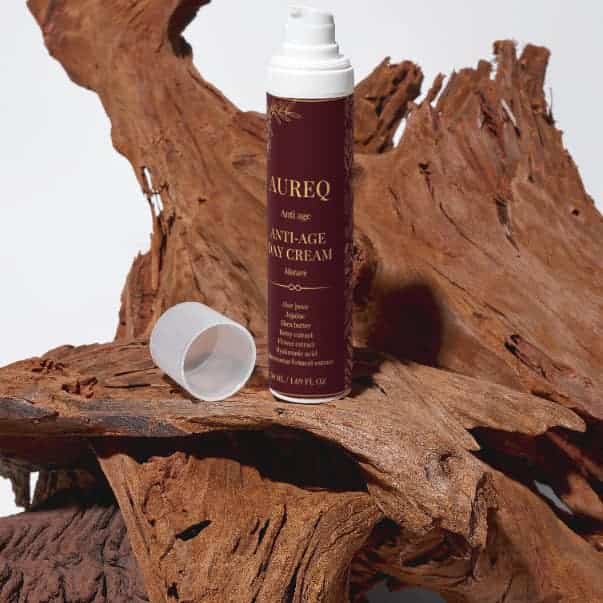 Hydrating day cream with hyaluronic acid by AUREQ displayed on wooden background.